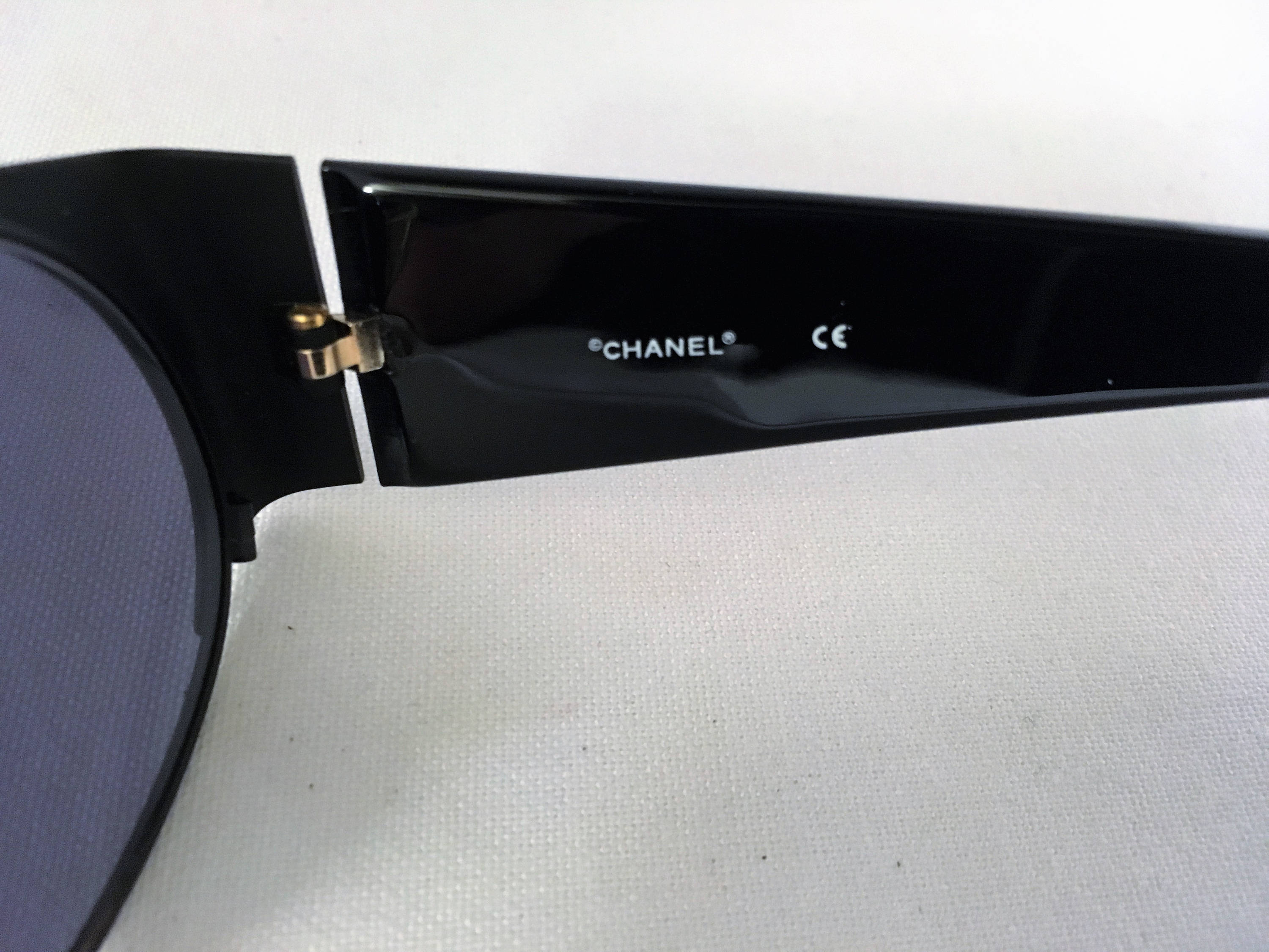 Chanel black oval sunglasses, circa 1995, adjustable nose pads Vintage Black Oval Chanel Sunglasses – by nothing new main image 4