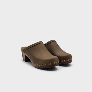 High heel studded clog mules with Olive green nubuck leather and dark brown wooden base.