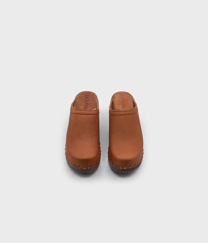 High heel studded clog mules with dexter tan brown nubuck leather and dark brown wooden base.