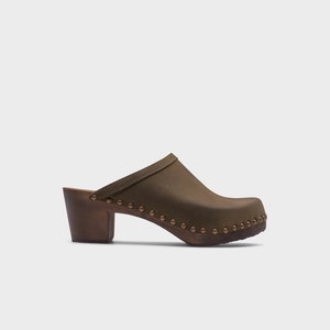 High heel studded clog mules with Olive green nubuck leather and dark brown wooden base.