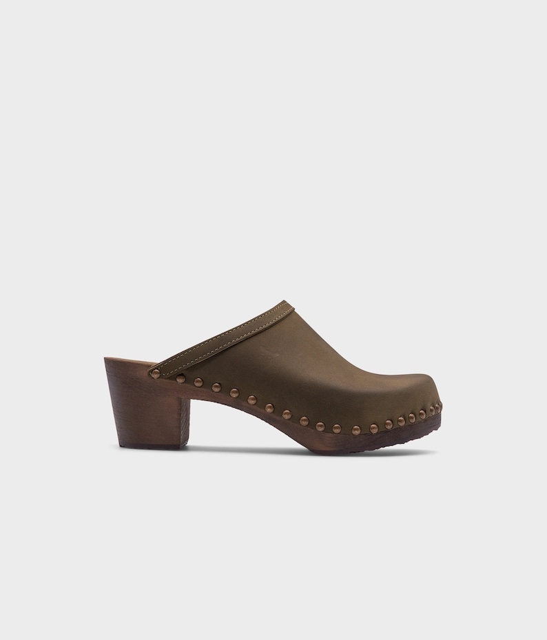 High heel studded clog mules with Olive green nubuck leather and dark brown wooden base.