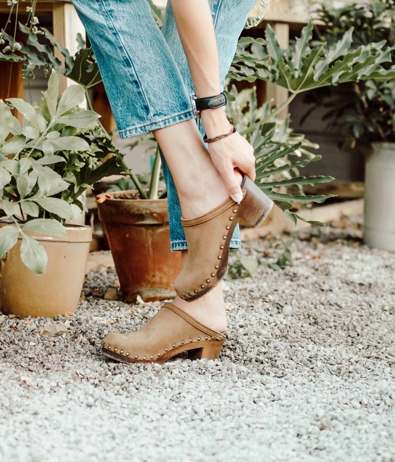 High heel studded clog mules with dexter tan brown nubuck leather and dark brown wooden base.