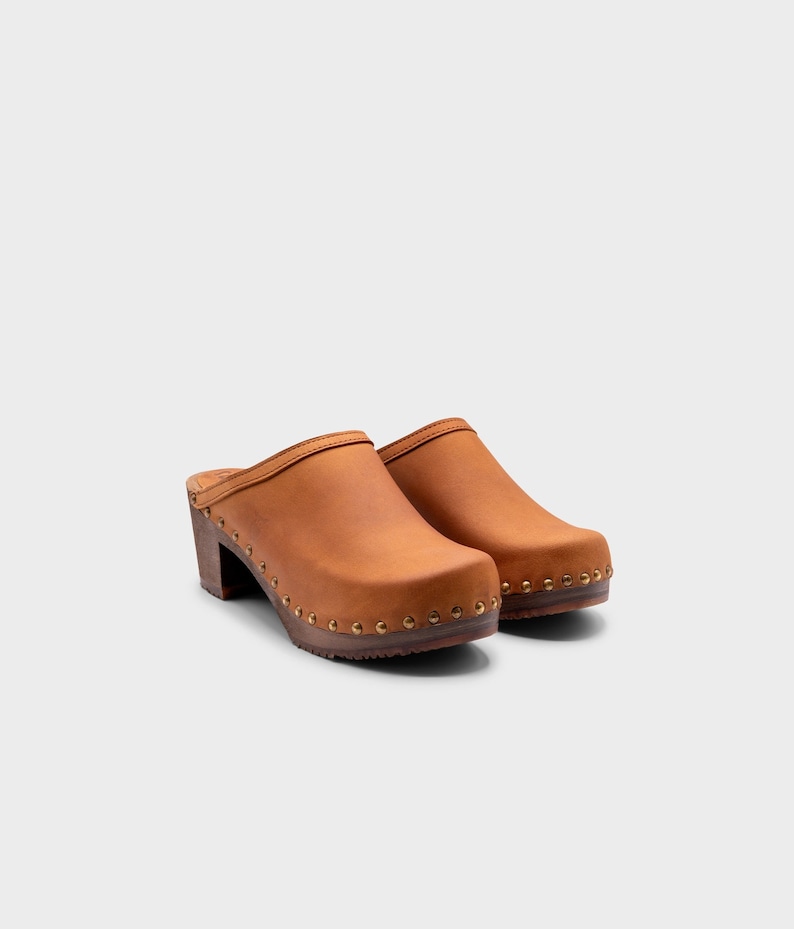 High heel studded clog mules with dexter tan brown nubuck leather and dark brown wooden base.