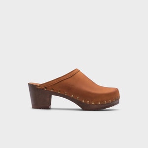 High heel studded clog mules with dexter tan brown nubuck leather and dark brown wooden base.