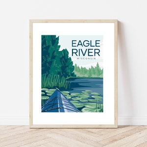 May include: A vintage-style poster with a blue kayak paddling through a river with lily pads. The text on the poster reads "Eagle River, Wisconsin".
