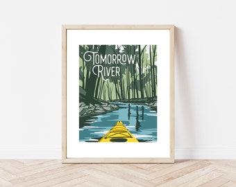 May include: A framed print of a yellow kayak paddling down a river surrounded by green trees. The text "Tomorrow River" is written in white on a green background.