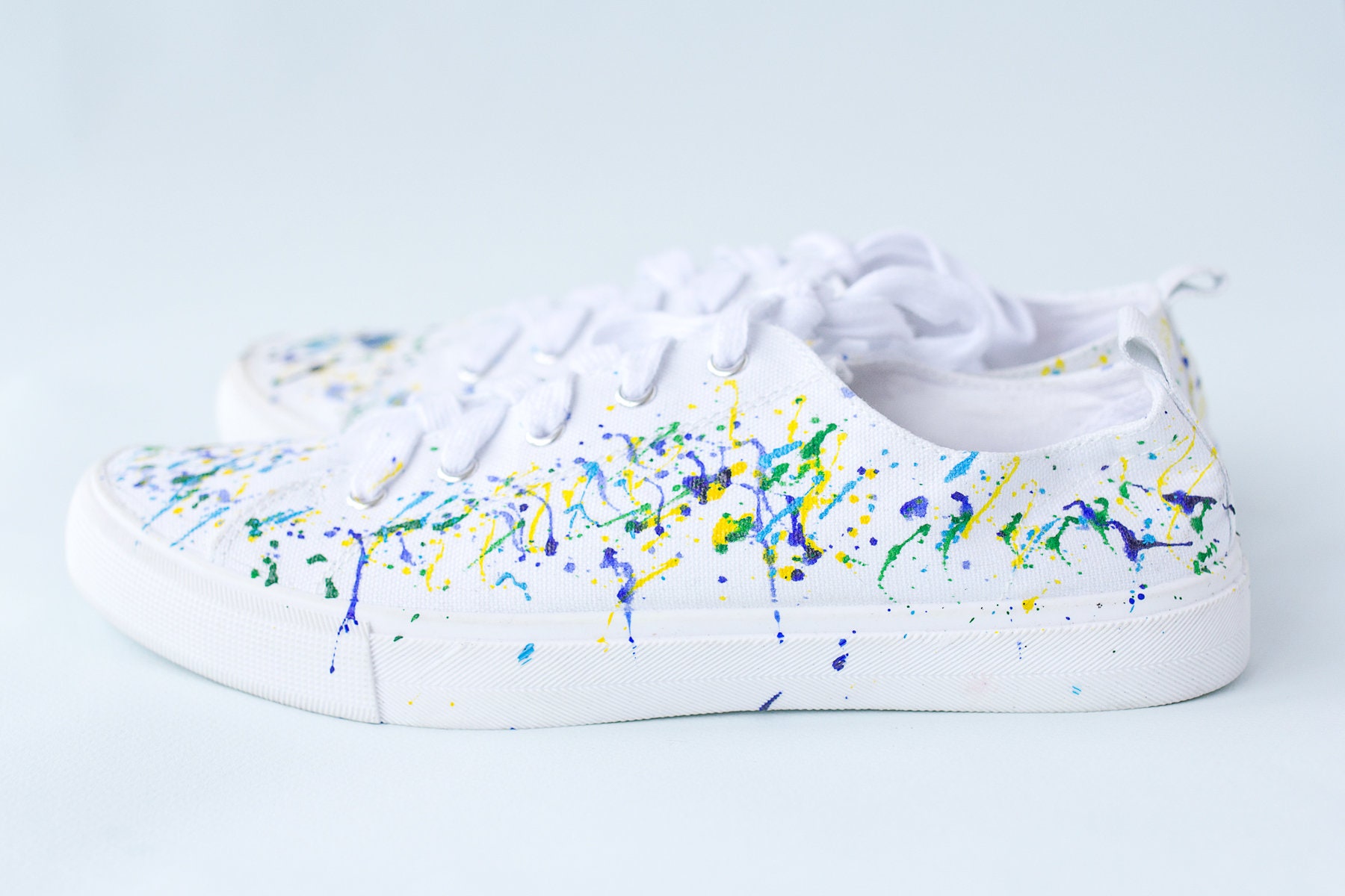 painted white sneakers