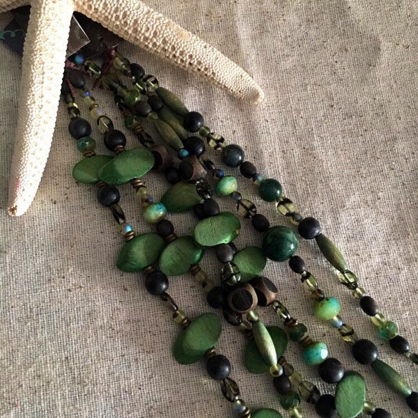 Green bead assortment strand with pressed glass, acrylic, crystal, wood and glass