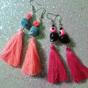 Beaded skull and tussle dangle earrings