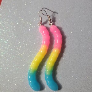 Pride flag earrings!  Pan flag colored gummy worm