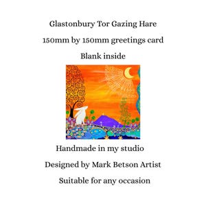 May include: A 150mm by 150mm square greetings card titled Glastonbury Tor Gazing Hare. The card features a vibrant illustration of a white hare in a colorful landscape with a purple hill, orange sky, and a crescent moon. Text includes Glastonbury Tor Gazing Hare, 150mm by 150mm greetings card, Blank inside, Handmade in my studio, Designed by Mark Betson Artist, Suitable for any occasion.