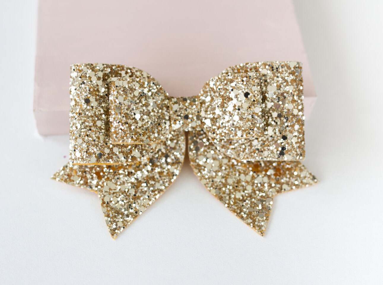 Oversized Large pale gold glitter fabric bow hair clip with tags down…