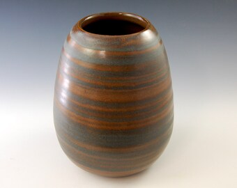 SC Blue Glazed Accent Piece / Stoneware Pottery Vase will add beautiful to your home. 9.25" tall x 7" wide at the widest point