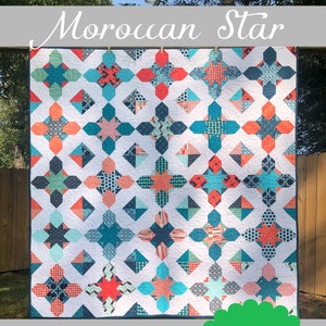 May include: A quilt pattern called "Moroccan Star" by Kelly Young. The quilt is made in three sizes and features a geometric design with teal, coral, and white colors. The quilt is hanging on a clothesline in a backyard.