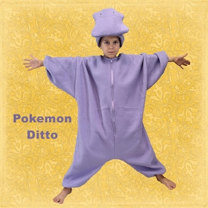 May include: A lavender Pokemon Ditto costume, including a hooded hat and a full-body jumpsuit with a front zipper. The costume features the text "Pokemon Ditto" in the lower left corner. The background is a yellow floral pattern.