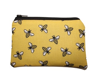Abejas en monedero amarillo