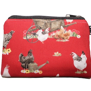 Hühner auf rotem Geldbeutel