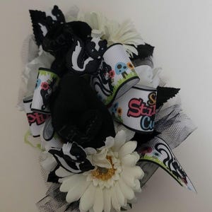 Skunk silk baby sock corsage