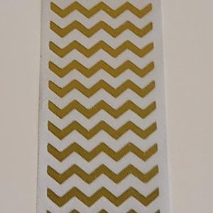 May include: White ribbon with a gold chevron pattern.