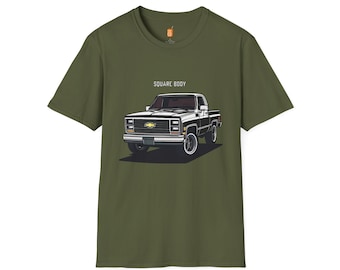 May include: A green t-shirt with a black and white illustration of a vintage pickup truck. The text "SQUARE BODY" is printed above the truck.
