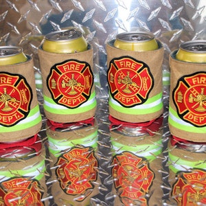 May include: Four tan can coolers with a red and gold firefighter emblem that says "Fire Dept."  The coolers have a green and white reflective stripe around the top.