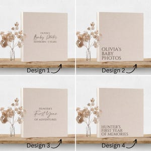 May include: Four square photo albums with beige linen covers, each featuring different text designs. Design 1 reads Olivia's Baby Photos Newborn-5 Years. Design 2 reads Olivia's Baby Photos. Design 3 reads Hunter's First Year of Adventures. Design 4 reads Hunter's First Year of Memories.