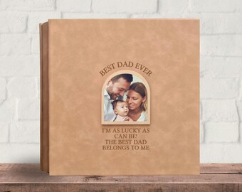 May include: A tan-colored photo album with the text "BEST DAD EVER" and a family photo. The album also has the text "I'M AS LUCKY AS CAN BE! THE BEST DAD BELONGS TO ME". The words "Text Design 1" are at the bottom.