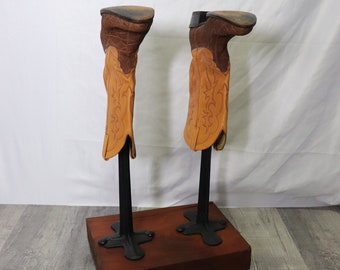 Repurposed boot stand made from repurposed cobbler's cast iron anvil, shoe stand, boot rack