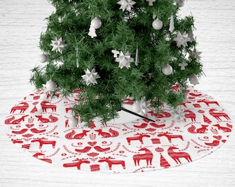 May include: White Christmas tree skirt with a red Scandinavian folk art pattern featuring reindeer, foxes, birds, and trees.