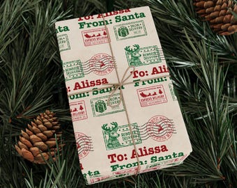 May include: A brown paper gift wrap with a repeating pattern of green and red Christmas stamps. The stamps feature reindeer, Christmas trees, and the words "Santa's Official Mail" and "Express Delivery". The text on the wrapping paper reads "To: Alissa From: Santa".