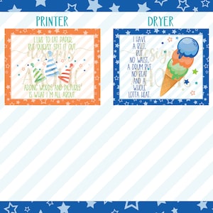 May include: Two colorful signs with a blue and white striped background. The sign on the left says "I like to eat paper, but quickly spit it out. Adding words and pictures is what I'm all about." The sign on the right says "I have a belt, but no waist, a drum but no beat and a whole lotta heat."