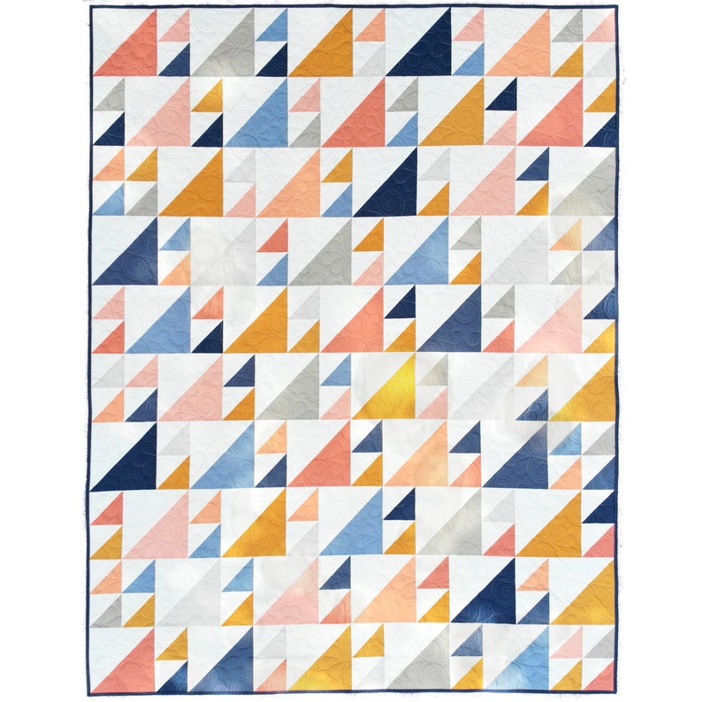 May include: A geometric quilt featuring a repeating pattern of triangles in various colors. The quilt showcases a palette of white, gray, navy, light blue, peach, and gold. The quilt has a dark blue border.