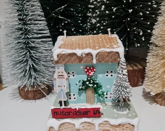 Nutcracker Ln.Pale aqua christmas house,with pale blue nutcracker with christmas tree with red street sign Christmas cottage,gift