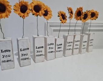 Love you mum.White wooden block with sunflower and simple message off love.mothers day. Mothering sunday.mum gifts
