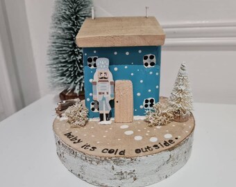 Baby its cold outside.blue christmas cottage with nutcracker,hand stamped sign,christmas tree.christmas gift.driftwood cottage.gifts.