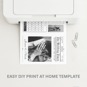 May include: A black and white wedding newspaper template is being printed from a white printer. The newspaper features the headline "The Wedding Times" and a photo of a couple. The text "James & Nicola" is also visible.