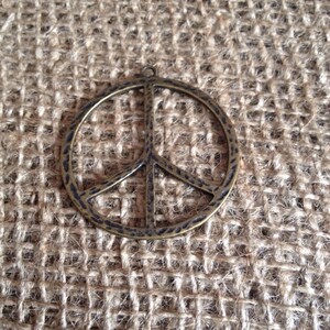 Antique brass peace pendant, free shipping, ships from Canada