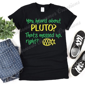 May include: Black t-shirt with green and yellow text that reads "You heard about Pluto? That's messed up, right?" with a yellow pineapple graphic.