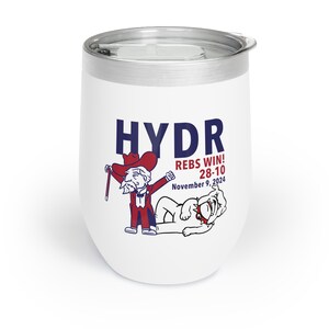 May include: White stainless steel wine tumbler with a cartoon illustration of a man in a red suit and a white bulldog. The text on the tumbler reads "HYDR REBS WIN! 28-10 November 9, 2024".