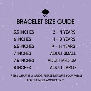 May include: A chart with a purple background and white polka dots shows bracelet sizes in inches and corresponding age ranges. The chart includes sizes for children and adults. The text reads "Bracelet Size Guide" and "*This chart is a guide. Please measure your wrist for the most accuracy*"