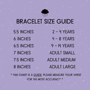 May include: A chart with a purple background and white polka dots shows bracelet sizes in inches and corresponding age ranges. The chart includes sizes for children and adults. The text reads "Bracelet Size Guide" and "*This chart is a guide. Please measure your wrist for the most accuracy*"