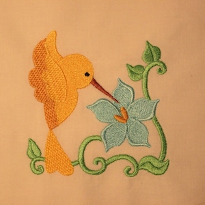 Hummingbird and flower machine embroidery design