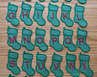 Freestanding lace alphabet sock ornaments. In the hoop project. Fits a 4x4 hoop. Stitch up your favorite holiday greeting.