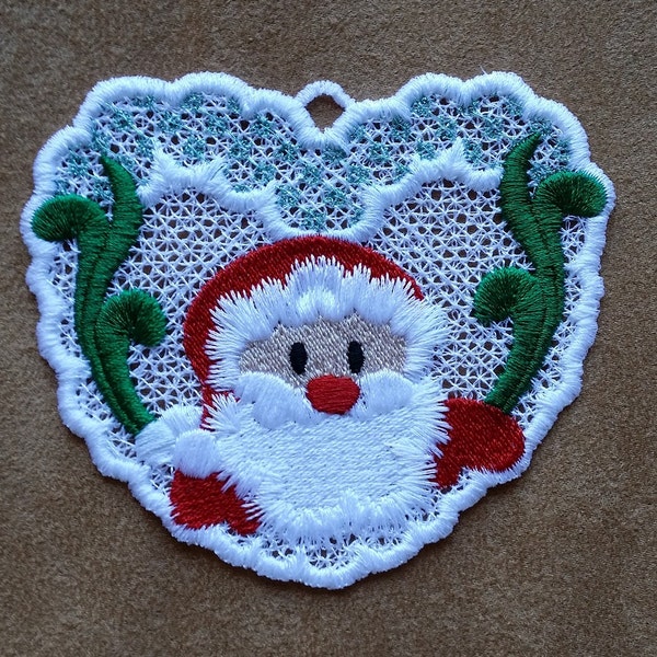 Freestanding lace Santa ornament. In the hoop project. Fits a 4x4 hoop. Stitch with metallic thread for extra pizazz. Fill version included.