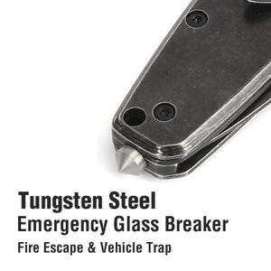 May include: Close-up of a tungsten steel emergency glass breaker. The tool has a pointed tip and two small holes. Tungsten Steel Emergency Glass Breaker. Fire Escape & Vehicle Trap.