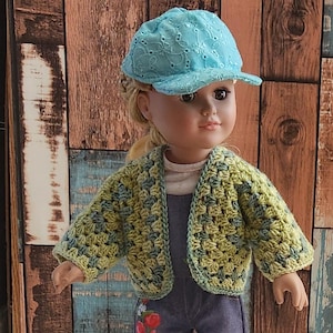 A crocheted cardigan with a light green and dark green color pattern. The cardigan is open in the front and has a loose fit.