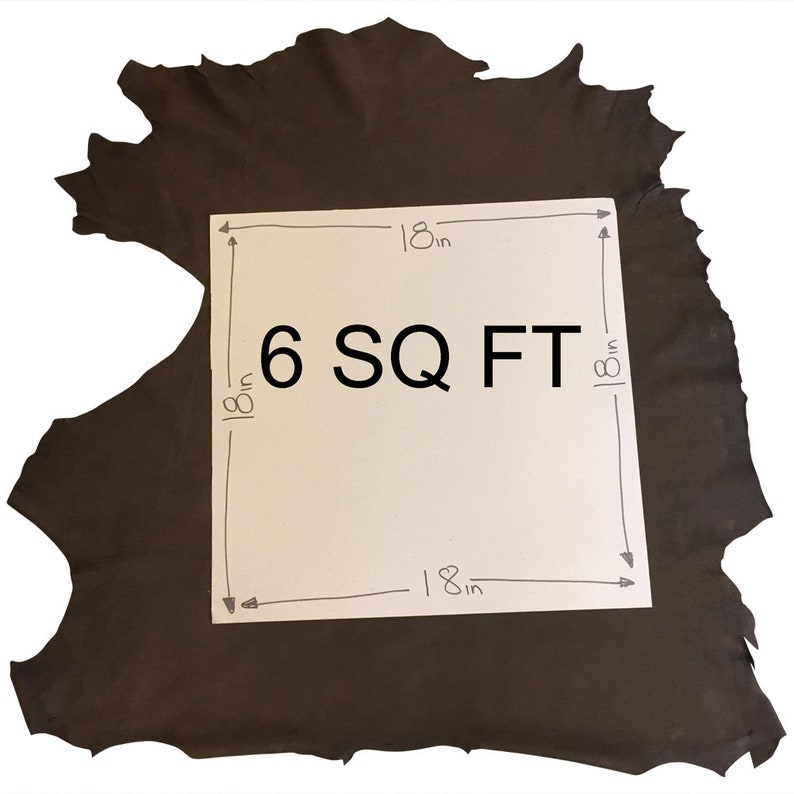 May include: A dark brown leather hide with a white square overlay. The overlay indicates the dimensions are 18 inches by 18 inches, with the text "6 SQ FT". The leather has a rough, uneven edge.