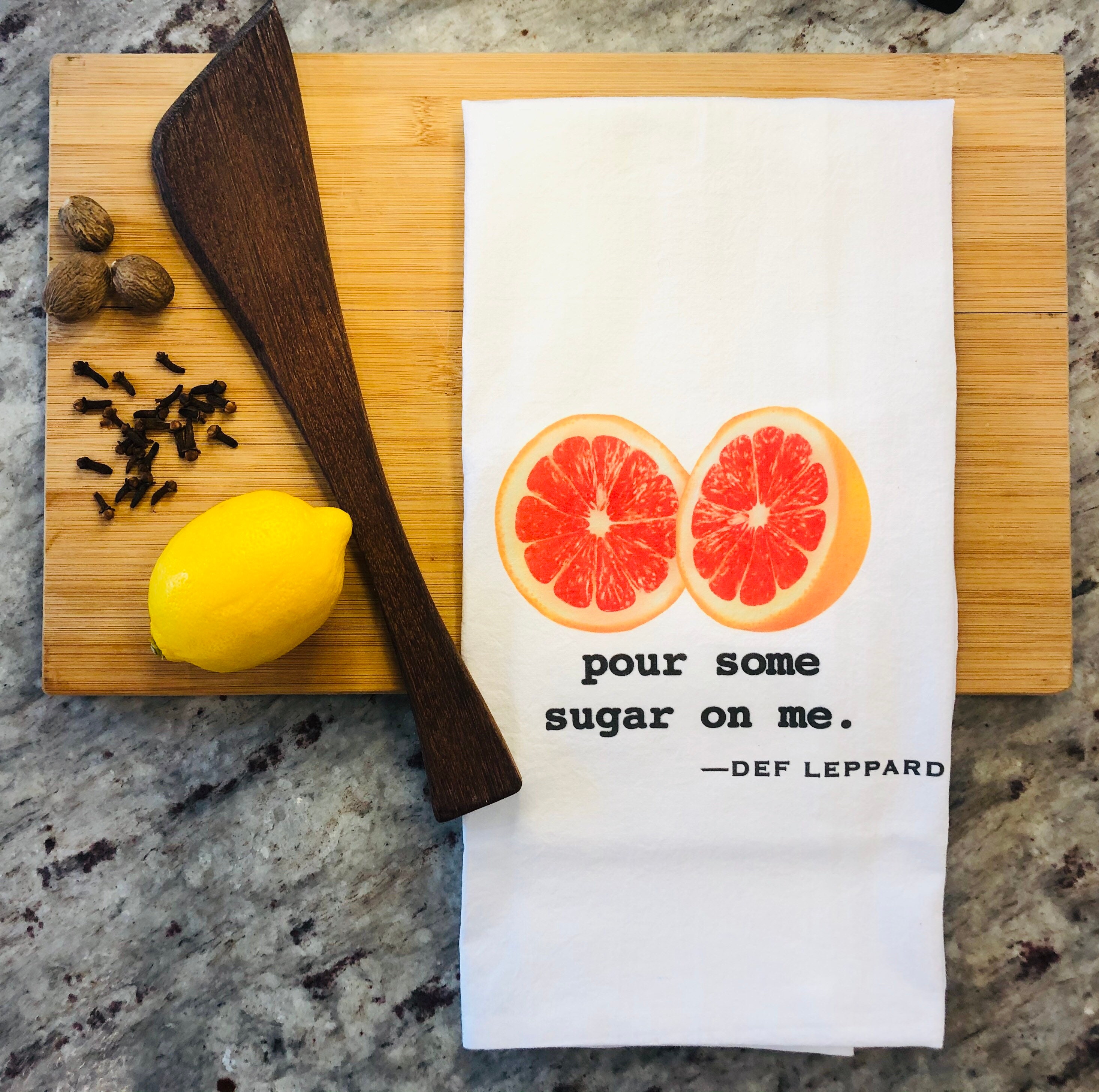 Funny tea towel: pour some sugar on me.
