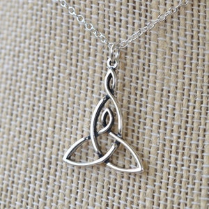 May include: Silver Celtic knot pendant necklace. The pendant is a traditional triquetra design, a symbol of life, love, and eternity.