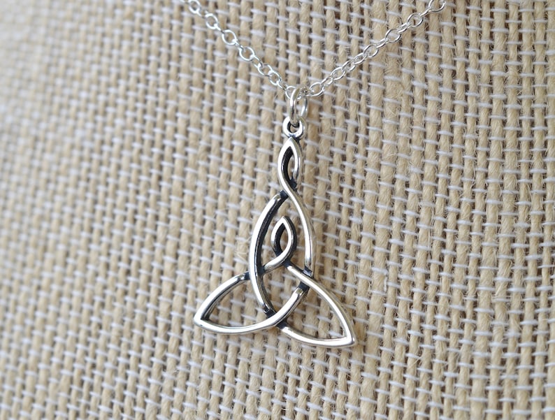 May include: Silver Celtic knot pendant necklace. The pendant is a traditional triquetra design, a symbol of life, love, and eternity.